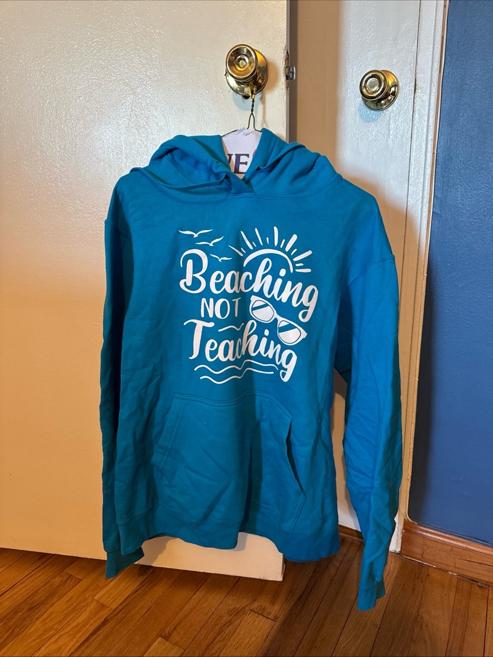 Turquoise Graphic Beach Hoodie with Sunglasses Design